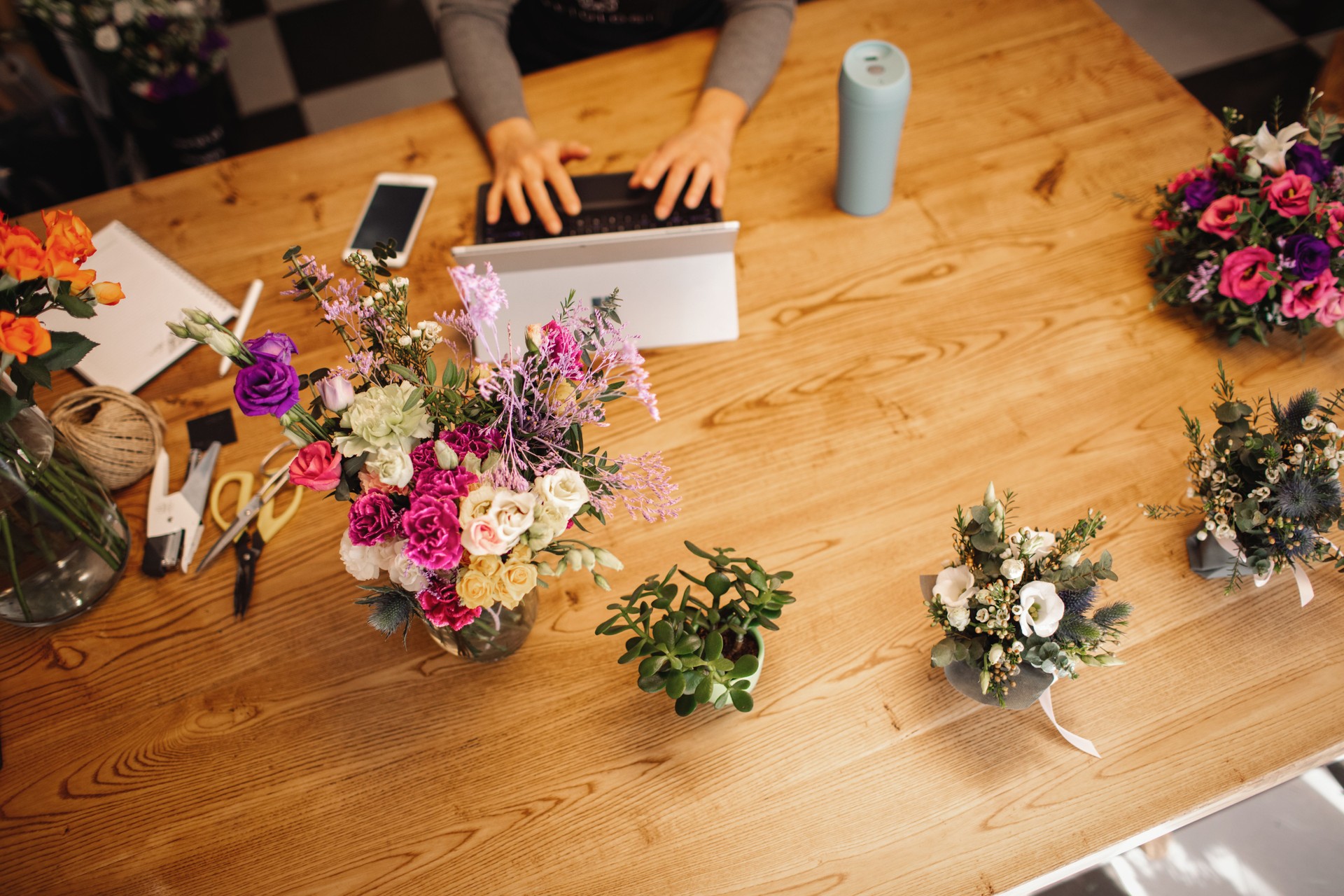 Female Florist Takes Online Orders